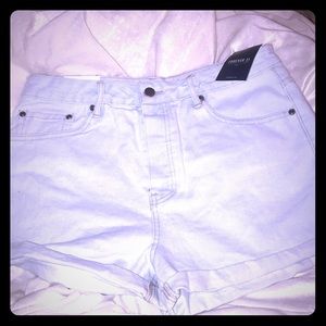 High wasted light blue flushed denim shorts.